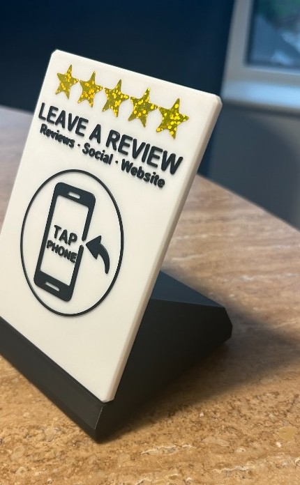 LocalTap Hub Block on a counter — Leave a Review face with Tap Phone NFC target